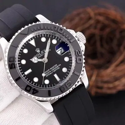 Black-dial watch on rubber strap